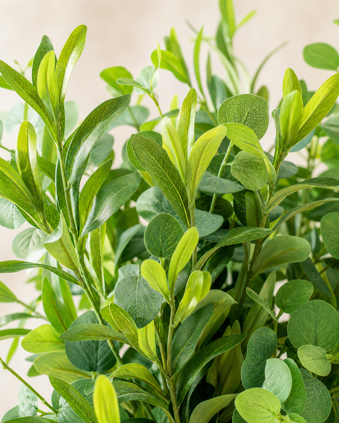 Dense artificial foliage in fresh natural green tones